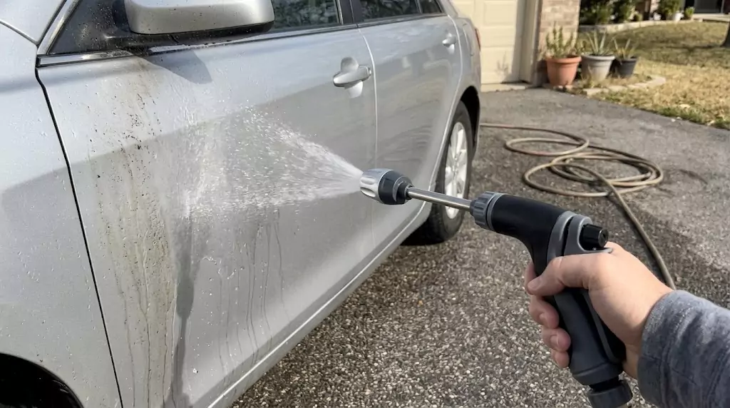 Jetterix being used to wash a car — gentle but effective spray on a silver sedan